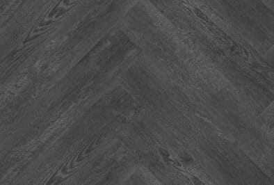 Visgraat Oscar diep zwart eiken PVC vloer van Stile Floors – realistische houtlook voor woonkamer en slaapkamer.